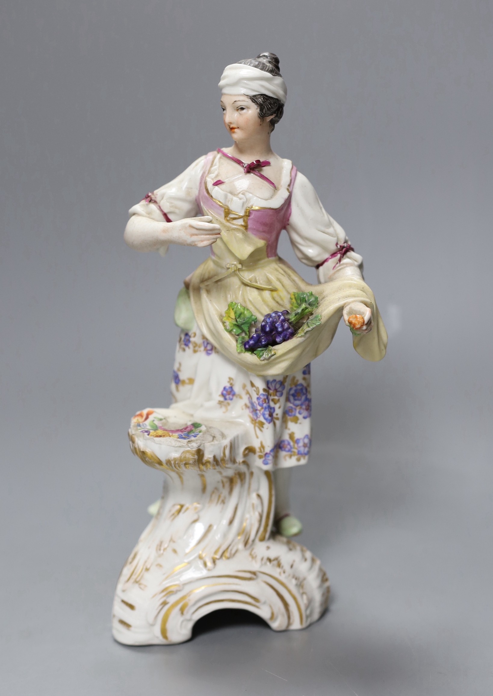 A Berlin porcelain figure of a fruit carrier, 22cm